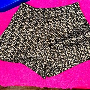 A brand new pair of casual shorts .They are cotton and polyester.